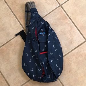 Kavu navy one shoulder backpack with red detailing
